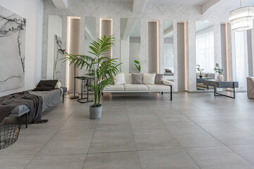 stylish bright modern bedroom interior with decorative niches with LED lighting and a huge...