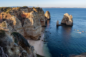 Selective focus of cliff texture on Ponta da Piedade with aerial view of Balança beach, Lagos - Algarve PORTUGAL