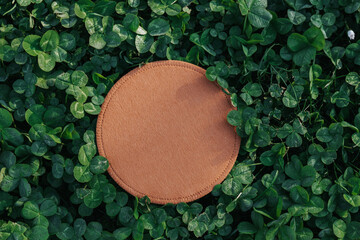 Earth Day.Clover background.Green blooming clover and brown round blank mockup.st patricks day background.Text place.