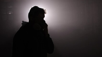 Surface preparation, Preparation steps, Prep work. Man readies himself for car painting by securing gas mask first.