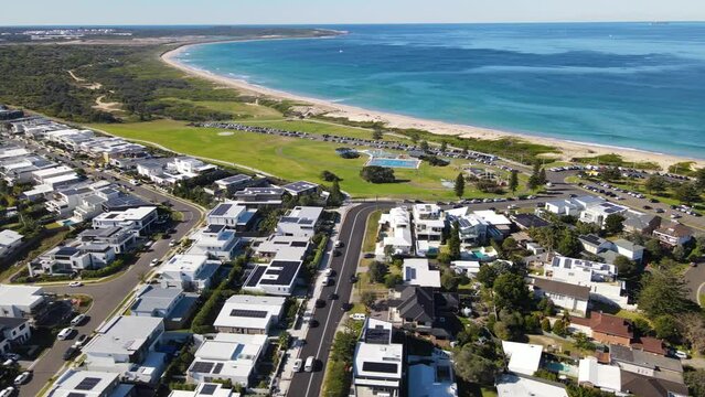 Aerial drone view of Cronulla looking toward Greenhills Beach and Wanda Beach in the Sutherland Shire, Sydney, NSW Australia on a sunny day in June 2023 
