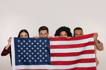 4th of July - Independence Day of USA. Happy friends with American flag on white background