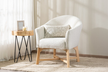modern chair in a cozy corner of a room, next to a round table, creating a warm and inviting...