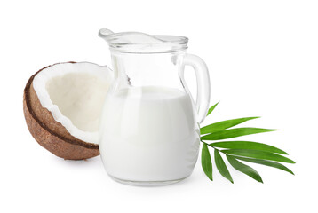 Glass jug of delicious vegan milk, coconut and leaf on white background