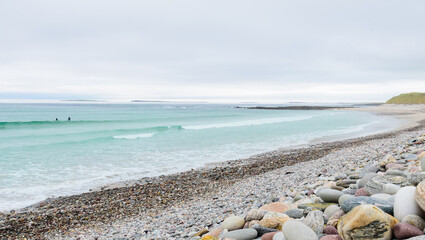 pebbled beach and Atlantic sea with waves