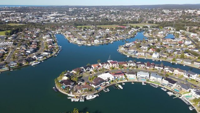 Aerial drone pullback reverse view of Sylvania Waters in the Sutherland Shire, Sydney, NSW Australia on a sunny day in June 2023 