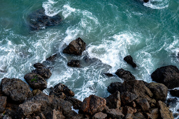 waves crashing on rocks