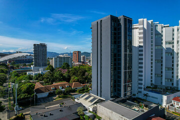 Beautiful aerial view of the Sabana Park in San Jose Costa Rica, and its Skyscrapers, next to the...