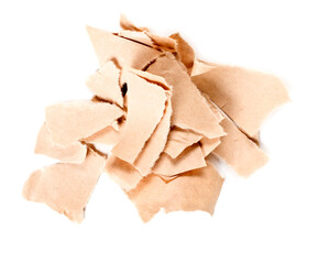 A pile of torn kraft paper is isolated on a white background