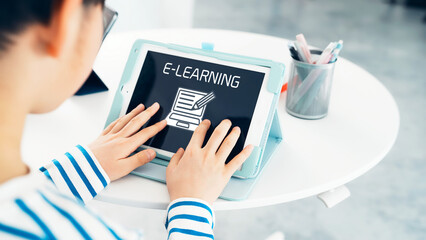 Boy studying with a tablet. e-learning concept. Online class.