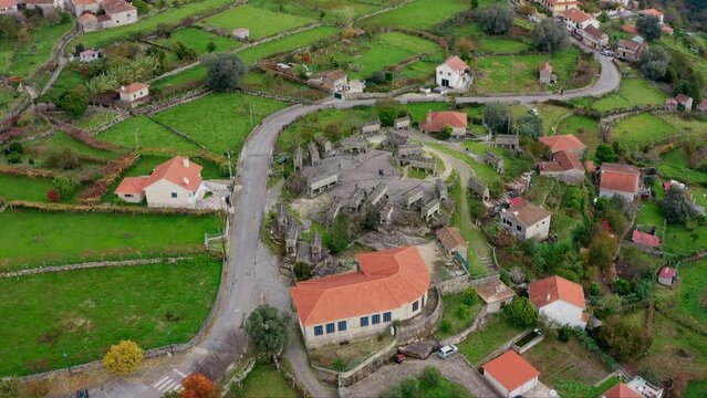 Village Of Soajo: Wide aerial orbit of Rural Espigueiros