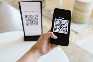 Qr code payment. E wallet. Man scanning tag accepted generate digital pay without money.scanning QR code online shopping cashless payment and verification technology concept.