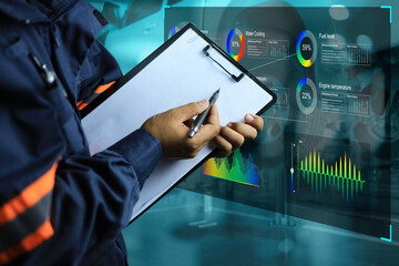 Engineers check the engine via a virtual screen with modern tools to accuracy precision corrections to repair damage point. modern technology vehicle inspection and maintenance