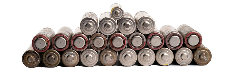 A pile of used batteries is isolated on a transparent background. Hazardous waste concept 