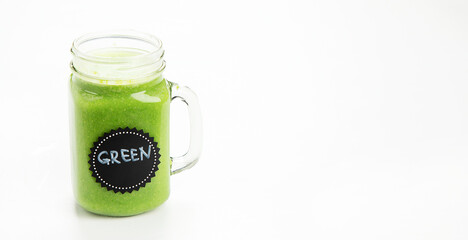 Healthy green smoothie  in a jar mug  on white background