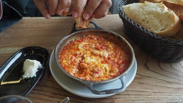 Turkish Menemen omelet in a frying pan. .