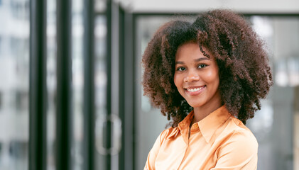 Portrait confident young businesswoman standing in office