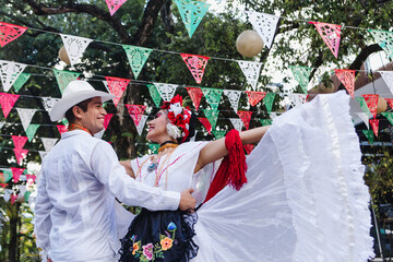 Latin couple of dancers wearing traditional Mexican dress from Veracruz Mexico Latin America, young...