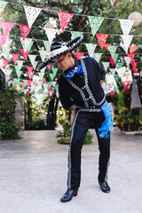 Latin man wearing as Traditional Mexican mariachi at parade or cultural Festival in Mexico Latin America, hispanic people in independence day or cinco de mayo