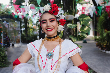 Fototapeta na wymiar Latin woman wearing traditional Mexican dress traditional from Veracruz Mexico Latin America, young hispanic female in independence day or cinco de mayo parade or cultural Festival