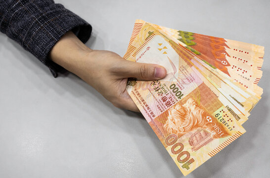Holding Hong Kong Dollars HKD on hand