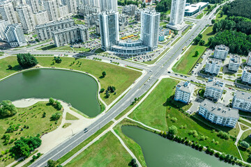 high-rise residential buildings and apartment houses on riverbank. aerial view. - obrazy, fototapety, plakaty