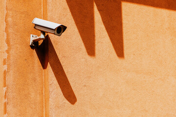Security surveillance camera on building wall