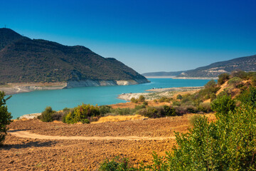 view of Kouris reservoir with lake in mountains of Cyprus - Kannaviou Dam, Limassol, Cyprus, hot summer day