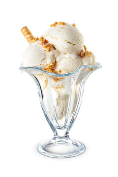 Vanilla ice cream scoops served on a tulip sundae glass cup isolated. Transparent PNG image.