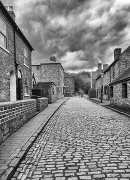 Black and white image of Victorian cobbled street