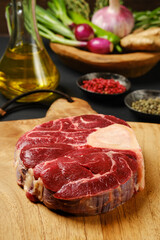 Closeup view of raw beef shank cross-cut on chopping board