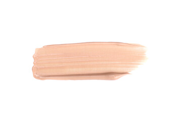 Smudged beige foundation cream isolated on white