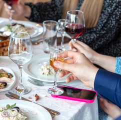 Close-up of a couple toasting with champagne at a restaurant