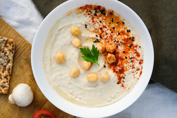 Healthy vegan homemade Hummus with olive oil and paprika with Chips. Homemade Hummus bowl Authentic cuisine. 