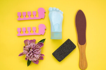 Tube-container for cosmetic foot cream. Concept of natural cosmetics and skin care. Set of pedicure tools. Studio shot with copy space, empty, unfilled