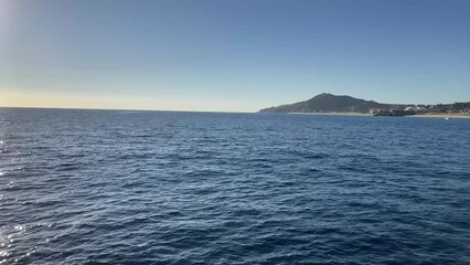 Enjoying the sailing of a sailboat in the Gulf of Mexico that sails in the Cape Saint Luke Arch in the Pacific Ocean of the Sea of Cortez, in Baja California Sur, Mexico.