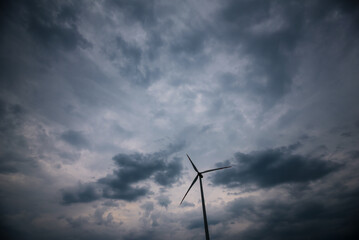 WEATHER - Rainy dramatic clouds over energy wind farm