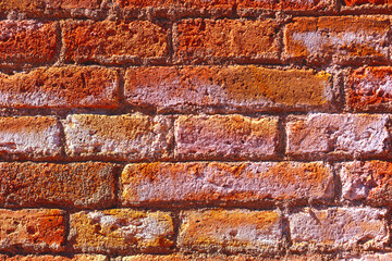 Old brick wall background texture close up. Red grunge brick wall texture