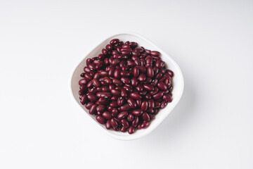 Red beans in a bowl on white background