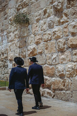 Obraz na płótnie Canvas city old town Jerysalem. Jewish men in black suits