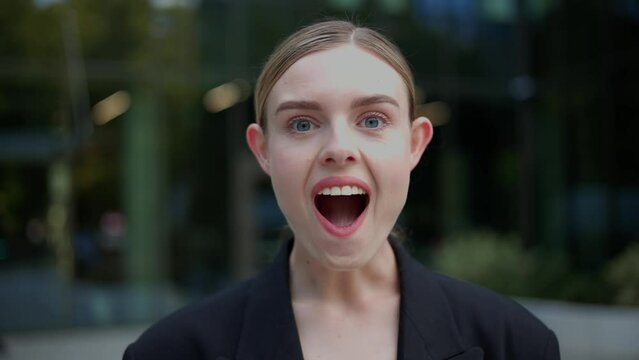 Portrait of young adult amazed happy woman looking at camera, opening her mouth eyes in surprise, feeling shock joy interest, receives unexpected good news, excited businesswoman impressed close up.