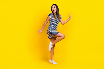Fototapeta na wymiar Photo of crazy positive lady wear stylish clothes have fun celebrate hen party look empty space isolated on yellow color background