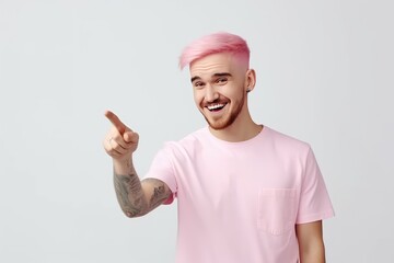 Naklejka premium A young man with pink hair points his index finger towards a blank space, inviting or advertising a special promotion. Generative AI