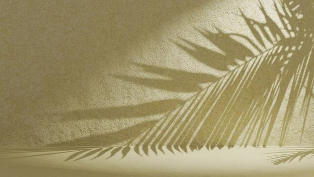 Yellow green textured wall with palm frond shadow waving in wind on back