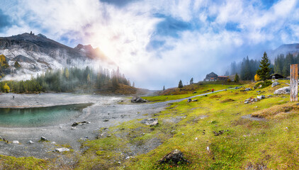 Incredible autumn view of Oeschinensee Lake.