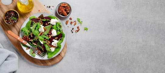 Fotobehang Fresh Salad with Beetroot, Feta Cheese, and Pecans, Healthy Vegetarian Meal on Grey Background © julie208