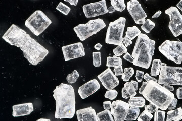 sugar crystals black background microscope