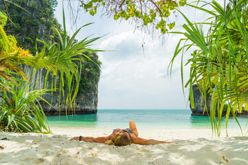 Woman at the beach in Thailand - 616947921
