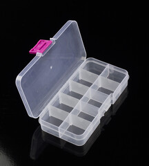 clear box for pills isolated on black background, box for tablets, box for vitamins