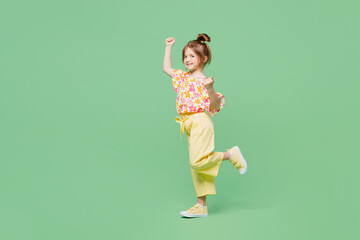Full body little child kid girl 6-7 years old wear casual clothes doing winner gesture celebrate...